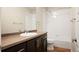 Bathroom featuring vanity and large mirror, bath tub and shower with white subway tiles at 5050 Akron St, Denver, CO 80238
