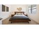 Serene bedroom with minimalist decor, modern platform bed, and tranquil atmosphere at 5050 Akron St, Denver, CO 80238