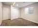 Carpeted bedroom features a window and closet with sliding doors for storage at 5050 Akron St, Denver, CO 80238