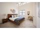 Bright bedroom with high ceilings, large window, and stylish décor for a relaxing retreat at 5050 Akron St, Denver, CO 80238