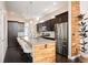 Modern kitchen featuring a spacious island with seating, stainless steel appliances, and stylish cabinetry at 5050 Akron St, Denver, CO 80238