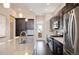 Stylish kitchen featuring sleek countertops, stainless steel appliances, and ample cabinetry at 5050 Akron St, Denver, CO 80238