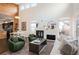 Bright living room boasts high ceilings, a fireplace, and an open floorplan with contemporary décor at 5050 Akron St, Denver, CO 80238