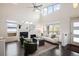 Inviting living room with a cozy fireplace, plush seating, and an abundance of natural light at 5050 Akron St, Denver, CO 80238