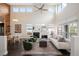 Bright living room featuring soaring ceilings, modern fireplace, and stylish furnishings at 5050 Akron St, Denver, CO 80238
