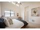 Bright main bedroom with vaulted ceiling, ample natural light, and contemporary design elements at 5050 Akron St, Denver, CO 80238