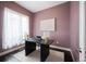 Cozy office space with modern desk, sheer curtains, and neutral color palette for a productive atmosphere at 5050 Akron St, Denver, CO 80238