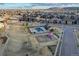 Aerial view of a neighborhood park featuring a playground and covered picnic area at 15468 W 50Th Pl, Golden, CO 80403