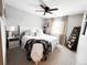 Bright and airy bedroom with a plush bed, neutral color palette, and natural light at 15468 W 50Th Pl, Golden, CO 80403