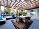 A covered outdoor seating area with a dining table and lounge furniture at 15468 W 50Th Pl, Golden, CO 80403