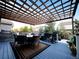 Outdoor patio with pergola and a dining table set for entertaining at 15468 W 50Th Pl, Golden, CO 80403