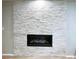 Stacked stone fireplace creates a cozy focal point in the living space at 15468 W 50Th Pl, Golden, CO 80403