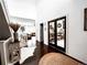 Welcoming foyer featuring dark wood floors and high ceilings leading to a comfortable living space at 15468 W 50Th Pl, Golden, CO 80403