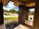 Charming covered porch with brick columns and meticulous landscaping creates a welcoming outdoor space at 15468 W 50Th Pl, Golden, CO 80403