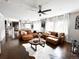 Spacious living area with leather couches, stylish decor, and plenty of natural light at 15468 W 50Th Pl, Golden, CO 80403