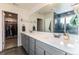 Bathroom features double sinks, quartz countertops, and a separate water closet at 11830 W 52Nd Ave, Wheat Ridge, CO 80033