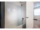 Bathroom with a shower and tub combination with a white tiled surround at 11830 W 52Nd Ave, Wheat Ridge, CO 80033