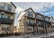 Attractive townhome exteriors with stone accents, balconies, and well-maintained landscaping at 11830 W 52Nd Ave, Wheat Ridge, CO 80033