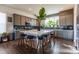 Modern kitchen with stainless steel appliances, large center island, and lots of natural light at 11830 W 52Nd Ave, Wheat Ridge, CO 80033