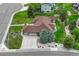 Lovely home with a three-car garage, beautiful landscaping and green lawn at 7170 Windwood Way, Parker, CO 80134