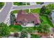 Expansive home featuring a well-maintained lawn, mature trees and outdoor living space at 7170 Windwood Way, Parker, CO 80134