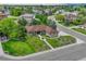 Aerial view of a single Gathering home in a lush neighborhood with many mature trees and green spaces at 7170 Windwood Way, Parker, CO 80134