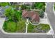 Charming single Gathering home with mature trees, green lawn and a walkway to the front door at 7170 Windwood Way, Parker, CO 80134