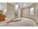 Basement featuring carpeted floors, staircase and access to a wet bar at 7170 Windwood Way, Parker, CO 80134