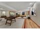 This basement features a game room with a kitchenette, comfortable seating, and a game table, perfect for hosting guests at 7170 Windwood Way, Parker, CO 80134