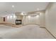 Finished basement with neutral carpet and a fireplace, and recessed lighting throughout at 7170 Windwood Way, Parker, CO 80134