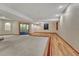 Spacious basement with neutral carpet and wood floors and recessed lighting throughout at 7170 Windwood Way, Parker, CO 80134
