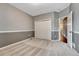 Bedroom with carpeted floor, closet and view to hallway entrance at 7170 Windwood Way, Parker, CO 80134