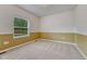 Bedroom featuring carpeted floors, bright white walls, and a window that brings in natural light at 7170 Windwood Way, Parker, CO 80134
