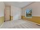 Comfortable bedroom with carpeted floors, closet, and a sunny window offering neighborhood views at 7170 Windwood Way, Parker, CO 80134