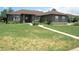 Ranch style home with mature landscaping and a sidewalk leading to the front door at 7170 Windwood Way, Parker, CO 80134
