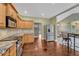 Well-equipped kitchen with granite countertops, stainless steel appliances, and access to a breakfast bar at 7170 Windwood Way, Parker, CO 80134