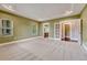 Large main bedroom with ample natural light, neutral carpet, and ensuite bathroom and walk-in closet access at 7170 Windwood Way, Parker, CO 80134