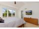 Bedroom featuring large windows with scenic views, vaulted ceilings and a wall-mounted television at 2856 Shadow Lake Rd, Lafayette, CO 80026
