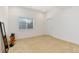 Well-lit bonus room with a window, mirror, and workout equipment offers versatile space at 2856 Shadow Lake Rd, Lafayette, CO 80026