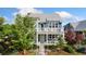 Stylish two-story home featuring a quaint front porch, a second-story balcony and colorful exterior at 2856 Shadow Lake Rd, Lafayette, CO 80026
