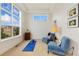 Bright flex room featuring large windows, cozy seating, and a peaceful atmosphere, great for yoga at 2856 Shadow Lake Rd, Lafayette, CO 80026