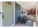 Inviting front porch with comfortable seating and a hanging swing, perfect for relaxing and enjoying the outdoors at 2856 Shadow Lake Rd, Lafayette, CO 80026