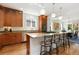 Bright kitchen boasts granite counters, stainless steel appliances, hardwood floors, and a large island with seating at 2856 Shadow Lake Rd, Lafayette, CO 80026