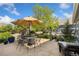Charming patio area with outdoor seating and lush landscaping, perfect for entertaining or relaxing at 2856 Shadow Lake Rd, Lafayette, CO 80026