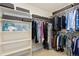 Walk-in closet with custom shelving, hanging rods, and storage for clothing, shoes, and accessories at 2856 Shadow Lake Rd, Lafayette, CO 80026