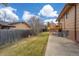 Spacious backyard with patio, deck, lawn, and privacy fence at 9720 W Kentucky Dr, Lakewood, CO 80226