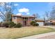 Charming brick two-story home with a well-maintained lawn and a two car garage at 9720 W Kentucky Dr, Lakewood, CO 80226