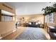 Inviting living room with hardwood floors, a large rug, comfortable seating, and plenty of natural light at 9720 W Kentucky Dr, Lakewood, CO 80226