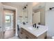 Contemporary bathroom vanity featuring double sinks, quartz countertops, and modern fixtures at 3420 N Steele St, Denver, CO 80205
