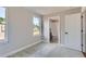 Bright bedroom featuring neutral walls, carpet flooring, and a window offering natural light and neighborhood views at 3420 N Steele St, Denver, CO 80205